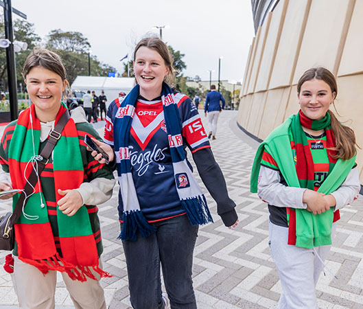 Young women at a rugby league game