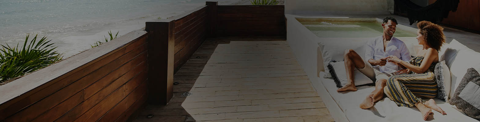 A happy couple relaxing at a beachside hotel