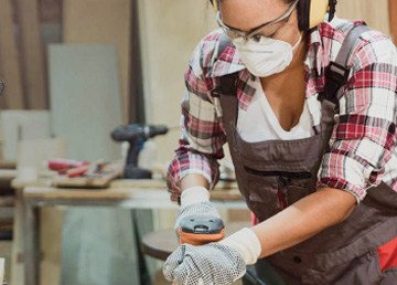 A person sanding some wood