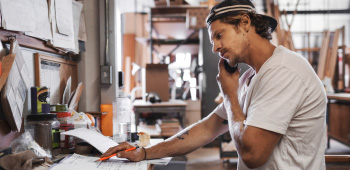 Small business owner talking on the phone.