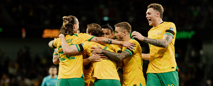 The Socceroos in a group hug